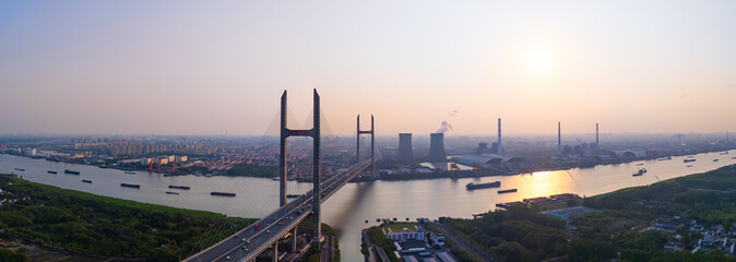 Aerial view of cars on MinPu bridge, The background is a Coal-fired power generation, Shanghai