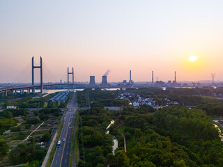Aerial view of cars on MinPu bridge, The background is a Coal-fired power generation, Shanghai