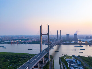 Aerial view of cars on MinPu bridge, The background is a Coal-fired power generation, Shanghai