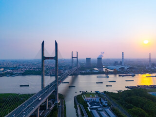 Aerial view of cars on MinPu bridge, The background is a Coal-fired power generation, Shanghai