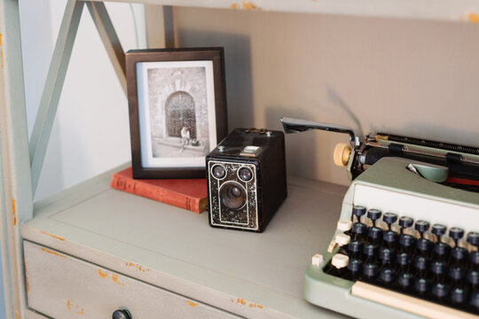 Home decor, timber shelving unit with books and vintage items