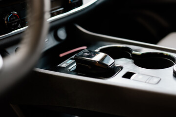 Automatic transmission shift selector in the car interior. Close-up of a manual gearshift of a modern car.
