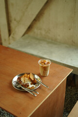 Closeup of Iced Caramel Macchiato at the coffee shop, Caramel Macchiato is a classic macchiato...