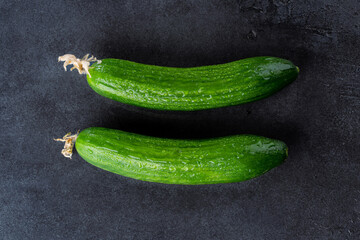 Fresh and tasty cucumber isolated on black background