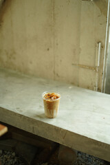 Closeup of Iced Caramel Macchiato at the coffee shop, Caramel Macchiato is a classic macchiato...