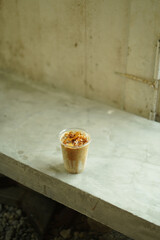 Closeup of Iced Caramel Macchiato at the coffee shop, Caramel Macchiato is a classic macchiato...