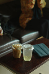 Closeup of Iced Caramel Macchiato at the coffee shop, Caramel Macchiato is a classic macchiato beverage. It consists of vanilla syrup, espresso, steamed milk, foam, and caramel drizzle