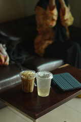 Closeup of Iced Caramel Macchiato at the coffee shop, Caramel Macchiato is a classic macchiato beverage. It consists of vanilla syrup, espresso, steamed milk, foam, and caramel drizzle