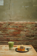matcha and toast bread on the wood table