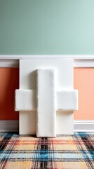 White Fluffy Cross Shaped Sculpture on Colorful Rug