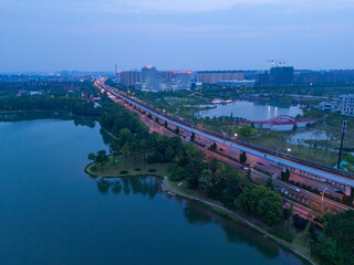 Fototapeta premium aerial view of urban scenery in the suburbs, with beautiful lake garden, Shanghai.