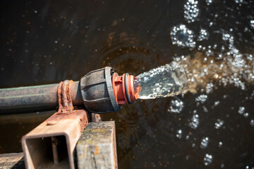pumping water to dam on farm poly pipe water irrigation repair on a farm in australia for a water trough in summer