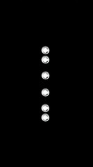 Diagonal Grid of White Dots on Black Background