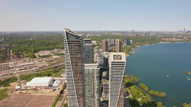 Aerial view of Humber Bay Shores, Etobicoke near Toronto area is chic waterfront gem. Epic cityscape condos buildings, vibrant green park trails near lakefront scenic escapes and modern living. Mimico