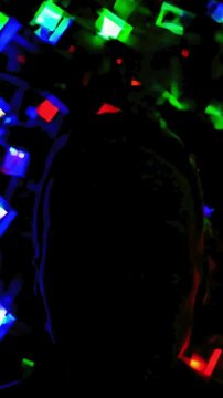 K UHD Video of a Geometric Graphic Shapes Flashing in the Background of a Mysterious Figure