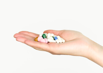 Handful of colorful pills and capsules