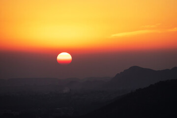 Stunning sunset over mountain landscape.