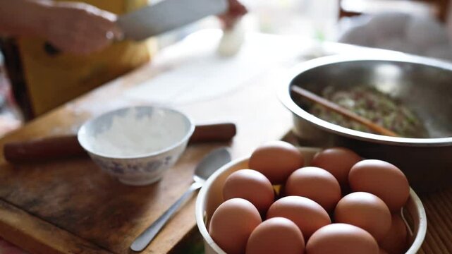 Making dumplings from scratch - squishing the dumpling dough to make the dumpling wrapper skins