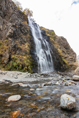 Stunning waterfall flowing into a serene river. Manthoka Waterfall is situated in the Kharmang Valley and is around 120km from Skardu. The waterfall is easily accessed by road.