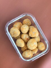 Cimol is a crispy-on-the-outside, chewy-on-the-inside Indonesian street snack made from tapioca flour. Usually served with spicy seasoning or sauce.