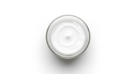 Top view of white creamy lotion in glass jar on white background