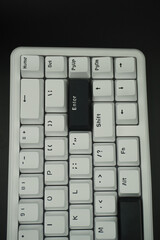 The black enter key on a mechanical keyboard with a monochrome theme