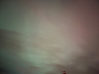 aurora light behind the clouds