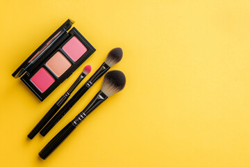 Minimal flat lay with cosmetic brushes and blush palette, pastel soft pink background, aesthetic composition