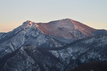 Fading sunlight  illuminates mountain peaks