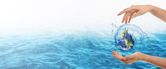 Female hands with water splashes on white background