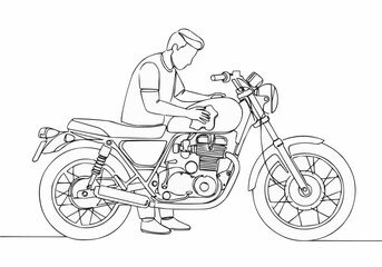 A person cleaning a classic motorcycle.
