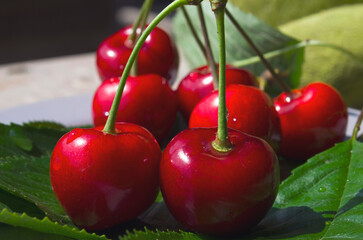 Red early cherries close-up. Vitamins and healthy nutrition