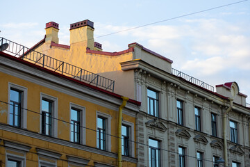 Obraz premium European historic building facades in soft sunrise light, architectural city background