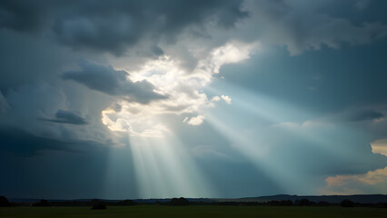 Dramatic sky with rays of sunlight breaking through clouds