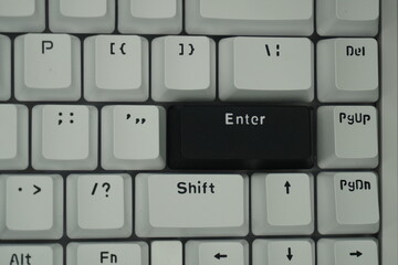 The black enter key on a mechanical keyboard with a monochrome theme