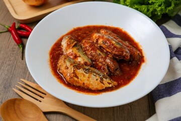 Mackerel in Tomato Sauce with chilli,canned fish,Tinned fish in a white plate	