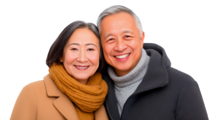 Happy and loving senior Asian couple embracing and wearing winter clothes, isolated on white or transparent background