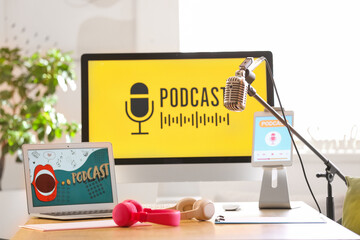 Podcaster's workplace with gadgets and microphone in studio