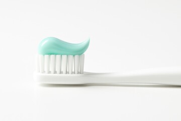 Toothbrush with mint toothpaste ready for daily dental care routine