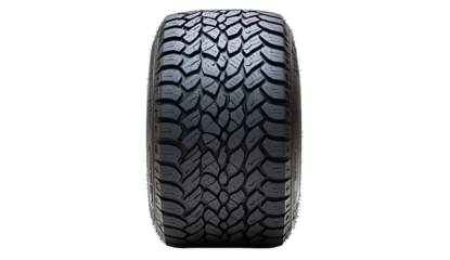 Detailed view of a rugged all-terrain vehicle tire tread against black backdrop