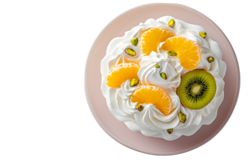 Delicious fruit pavlova with kiwi, tangerine, and pistachios on pink plate