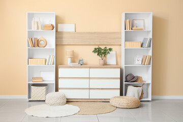 Interior of room with bookshelves and commode