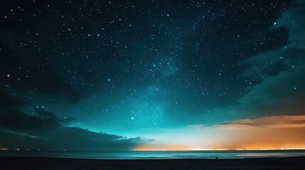 An empty sky filled with tiny distant stars beginning to twinkle as dusk transitions to night.