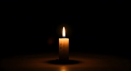 Single Candle Flame Illuminating Darkness