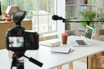 Podcaster's workplace with laptop and microphone in studio