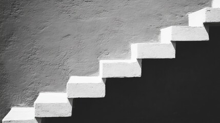 Exterior steps leading upward against a textured wall.