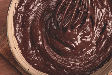 a bowl of chocolate dough, a whisk for whipping, baking, structure and consistency, homemade, top...