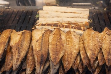 Turkish street food in Istanbul. The process of preparing balik ekmek on the embankment next to the...