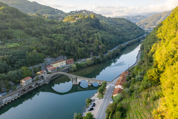 Aerial view of Ponte della Maddalena (Devil's Bridge) and the Serchio river, near Borgo a Mozzano,...