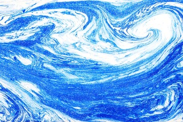Abstract swirling patterns of blue and white.